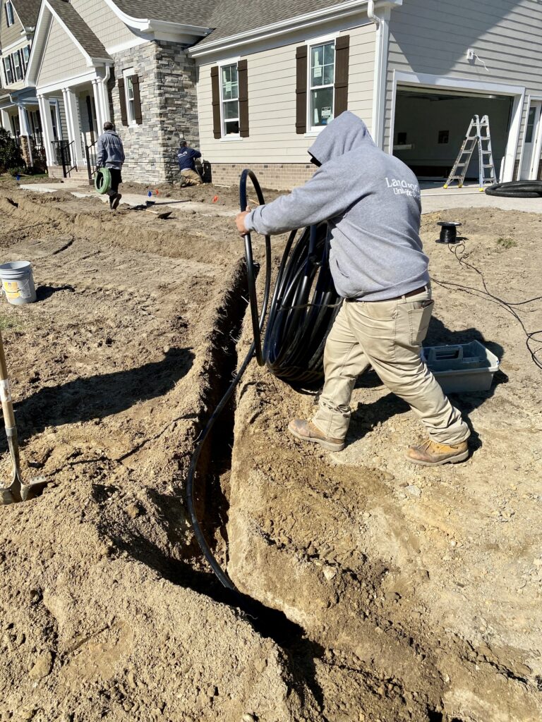 laying irrigation pipe in yard