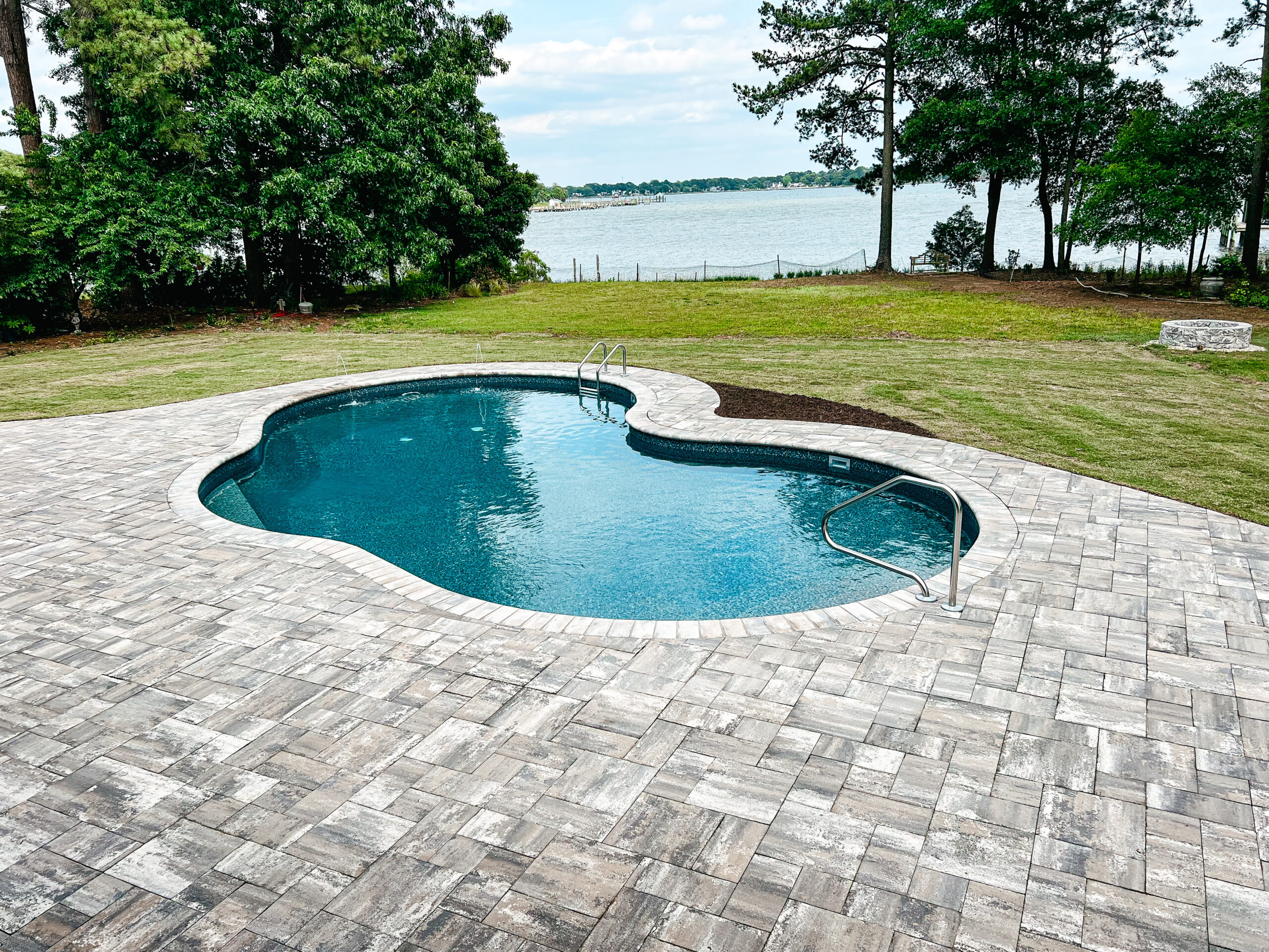 in-ground pool along waterway