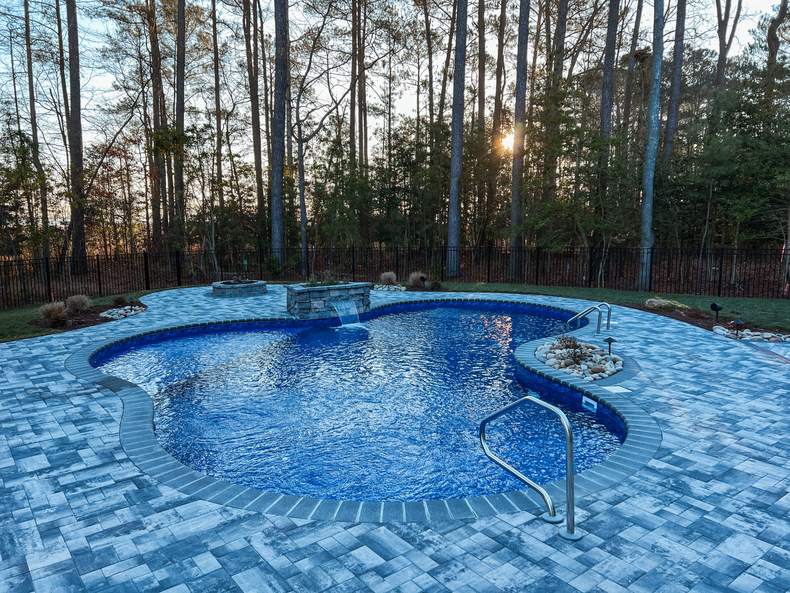 in-ground pool sunset